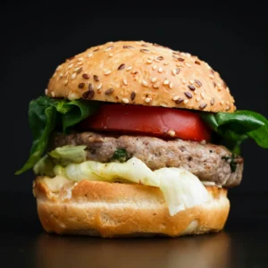 Soft chicken shami kebab burger with onion and mint sauce on a dark background - Seohara Kitchen
