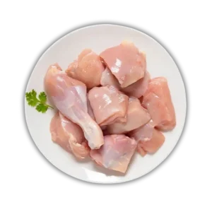 Plate of fresh, pink, raw chicken curry cut pieces with skinless drumsticks and breast pieces. Order fresh halal chicken online from Seohara Express in Seohara, Bijnor.