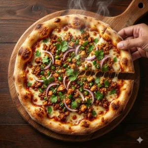 Desi style Chicken Keema Pizza topped with minced chicken, green chillies and onions.